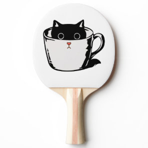Black kitten with red nose hiding in a cup ping pong paddle