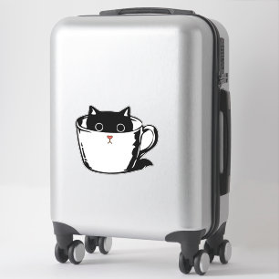 Black kitten with red nose hiding in a cup sticker