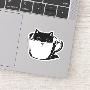 Black kitten with red nose hiding in a cup sticker