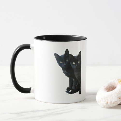 Black kittens mug