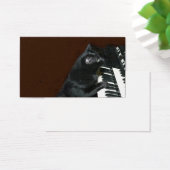 Black kitty cat play the organ (Desk)
