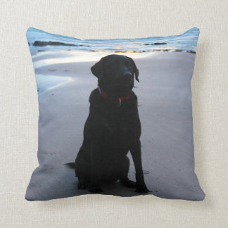 Black Labrador on a beach Throw Pillow