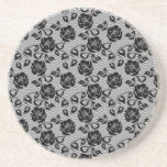 Black lace pattern on white background coaster