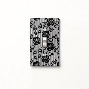 Black lace pattern on white background light switch cover