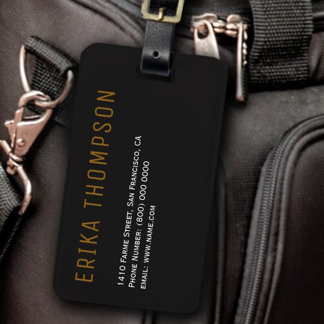 black luggage tag with her name and address (Creator Uploaded)