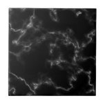 Black marble effect tile<br><div class="desc">Looking for a tile that can add an elegant and sophisticated touch to your home? Look no further than our Marble Effect Tile in classic black and white. The stunning marble effect on this tile creates a timeless and chic sense of luxury, while the contrasting black and white colors make...</div>