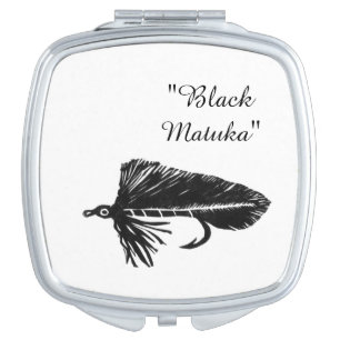 Black matuka streamer for fly fishing fly tying compact mirror
