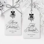 Black Mistletoe Merry Christmas | Feliz Navidad  Gift Tags<br><div class="desc">This holiday gift tag features elegant,  romantic swirly calligraphy with a winter mistletoe bouquet and a festive 'Merry Christmas' on the front,  along with 'Feliz Navidad' script on the back. For more advanced customization of this design,  please click the BLUE DESIGN TOOL BUTTON above!</div>