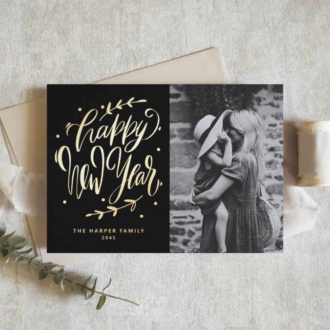 Black Modern Calligraphy and Wreath New Year Photo Foil Holiday Card (Customizable photo gold foil Happy New Year card featuring modern calligraphy and wreath.)