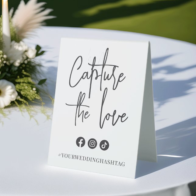 Black | Modern Handwritten Script Wedding Hashtag Table Tent (Creator Uploaded)