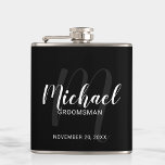 Black Modern Script Personalized Groomsmen Flask<br><div class="desc">Add a personal touch to your wedding with personalized groomsmen flask. This flask features personalized groomsmen's name in white modern script font style and monogram in light grey modern script font style as background with title and wedding date in white modern sans serif font style on black background. Also perfect...</div>