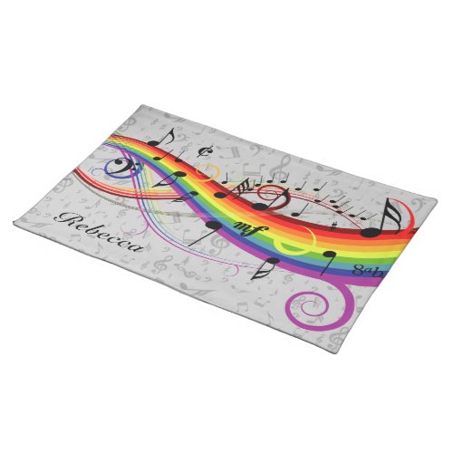 Black musical notes floating on a rainbow cloth placemat