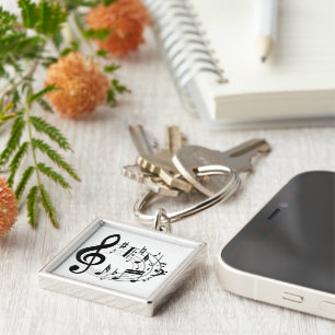 Black musical notes in oval shape keychain
