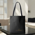 Black Name Gold Girly Script Monogram Modern Tote Bag<br><div class="desc">Black and Gold Elegant Add Your Own Name Monogram Book Bag. This Book Bag can be customized to include your initial and first name and given as a gift for Christmas,  Sweet 16 Birthday,  Bridal Shower or a Wedding.</div>