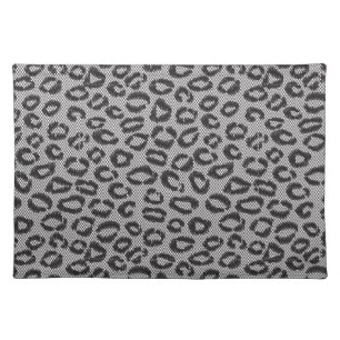 Black net lace with leopard pattern on white cloth placemat