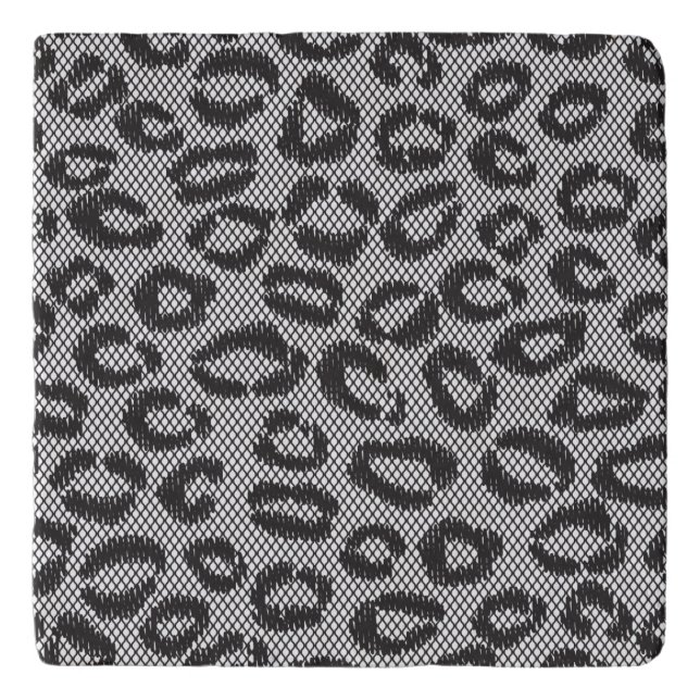 Black net lace with leopard pattern on white trivet (Front)