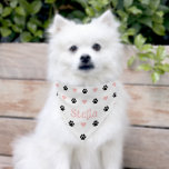 Black Paw Pink Hearts White Pet Bandana Collar<br><div class="desc">Give your furry friend a stylish and playful look with this custom pet bandana! Featuring a cute bone-style font that spells out your pet’s name, along with adorable black paw prints and soft pink hearts, this bandana is both fun and fashionable. Perfect for everyday wear, special occasions, or adorable photoshoots....</div>