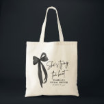 Black Pink Bow She's Tying the Knot Bridal Shower  Tote Bag<br><div class="desc">Add a stylish touch to your bridal shower with our Black Pink Bow She's Tying the Knot Bridal Shower Tote Bag! Featuring a chic black design with a feminine pink bow, this tote bag is perfect for carrying favors, gifts, or essentials for the special day. It's an elegant and practical...</div>