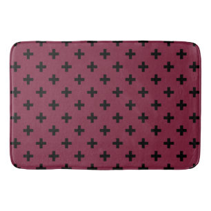 Black polka crosses on mulberry bath mat