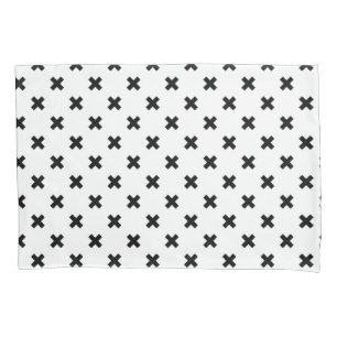 Black polka crosses on white pillow case