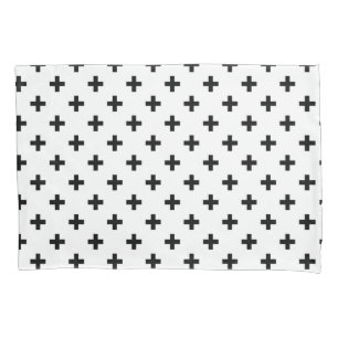 Black polka crosses on white pillow case