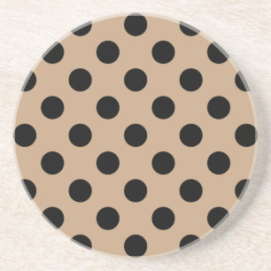 Black polka dots on beige drink coaster
