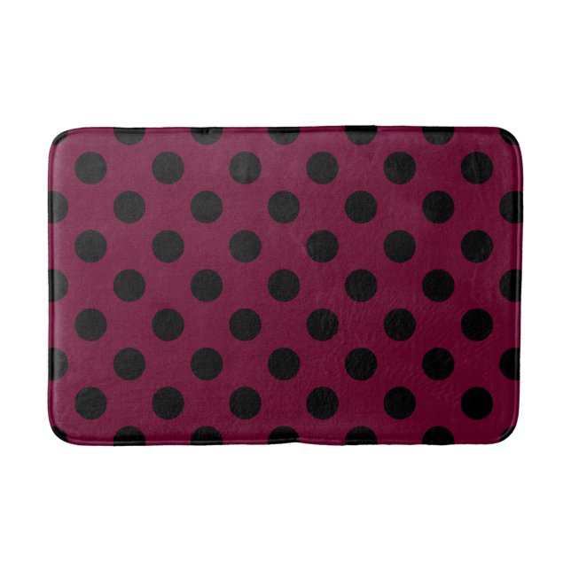 Black polka dots on burgundy bathroom mat (Front)