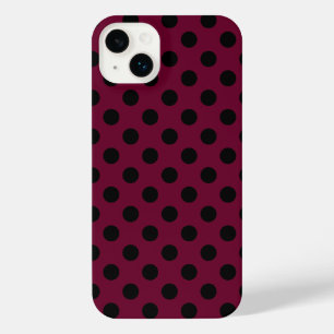 Black polka dots on burgundy iPhone 14 plus case