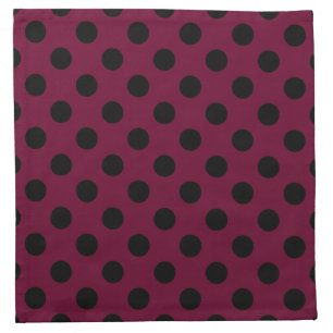 Black polka dots on burgundy napkin
