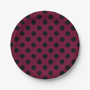 Black polka dots on burgundy paper plates
