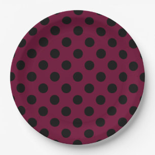 Black polka dots on burgundy paper plates