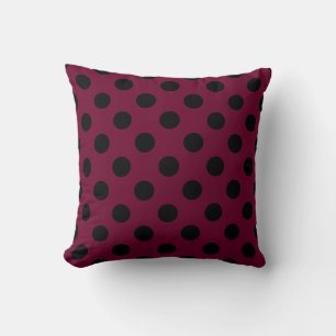 Black polka dots on burgundy throw pillow