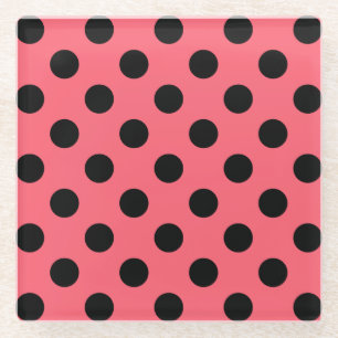 Black polka dots on coral glass coaster