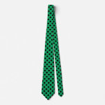 Black polka dots on fresh green neck tie