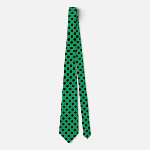 Black polka dots on fresh green neck tie