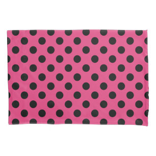 Black polka dots on fuchsia pillowcase