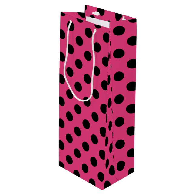 Black polka dots on fuchsia wine gift bag (Front Angled)