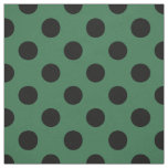 Black polka dots on kelly green fabric