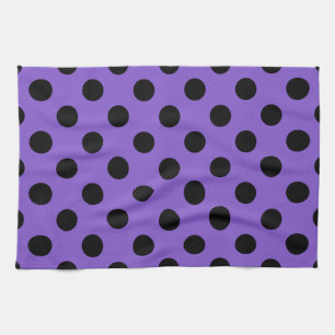 Black polka dots on lavender towel