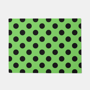 Black polka dots on lime green doormat