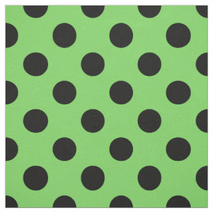Black polka dots on lime green fabric