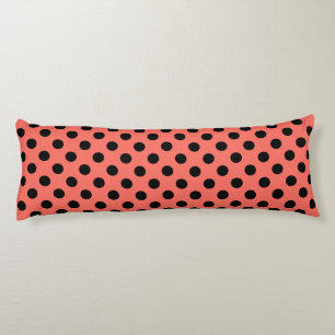 Black polka dots on living coral body pillow