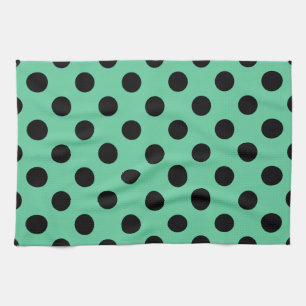 Black polka dots on mint green towel