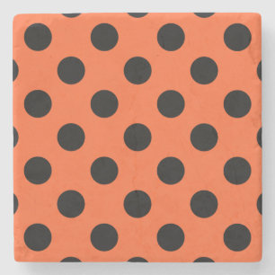 Black polka dots on orange stone coaster