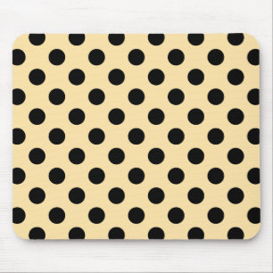 Black polka dots on pale yellow mouse pad