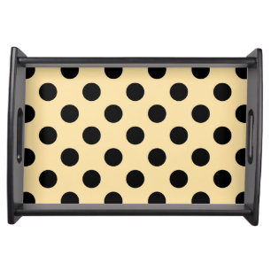 Black polka dots on pale yellow serving tray