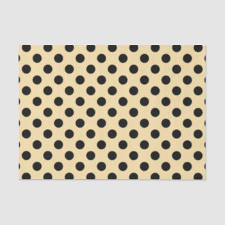 Black polka dots on pale yellow tissue paper