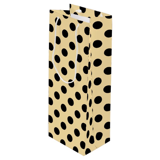 Black polka dots on pale yellow wine gift bag (Front Angled)