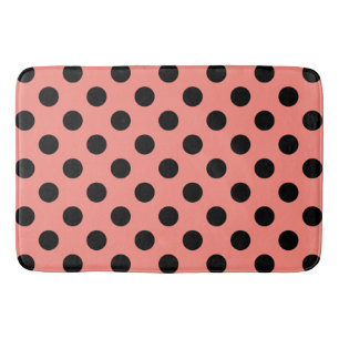 Black polka dots on peach bathroom mat
