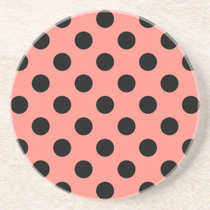 Black polka dots on peach drink coaster